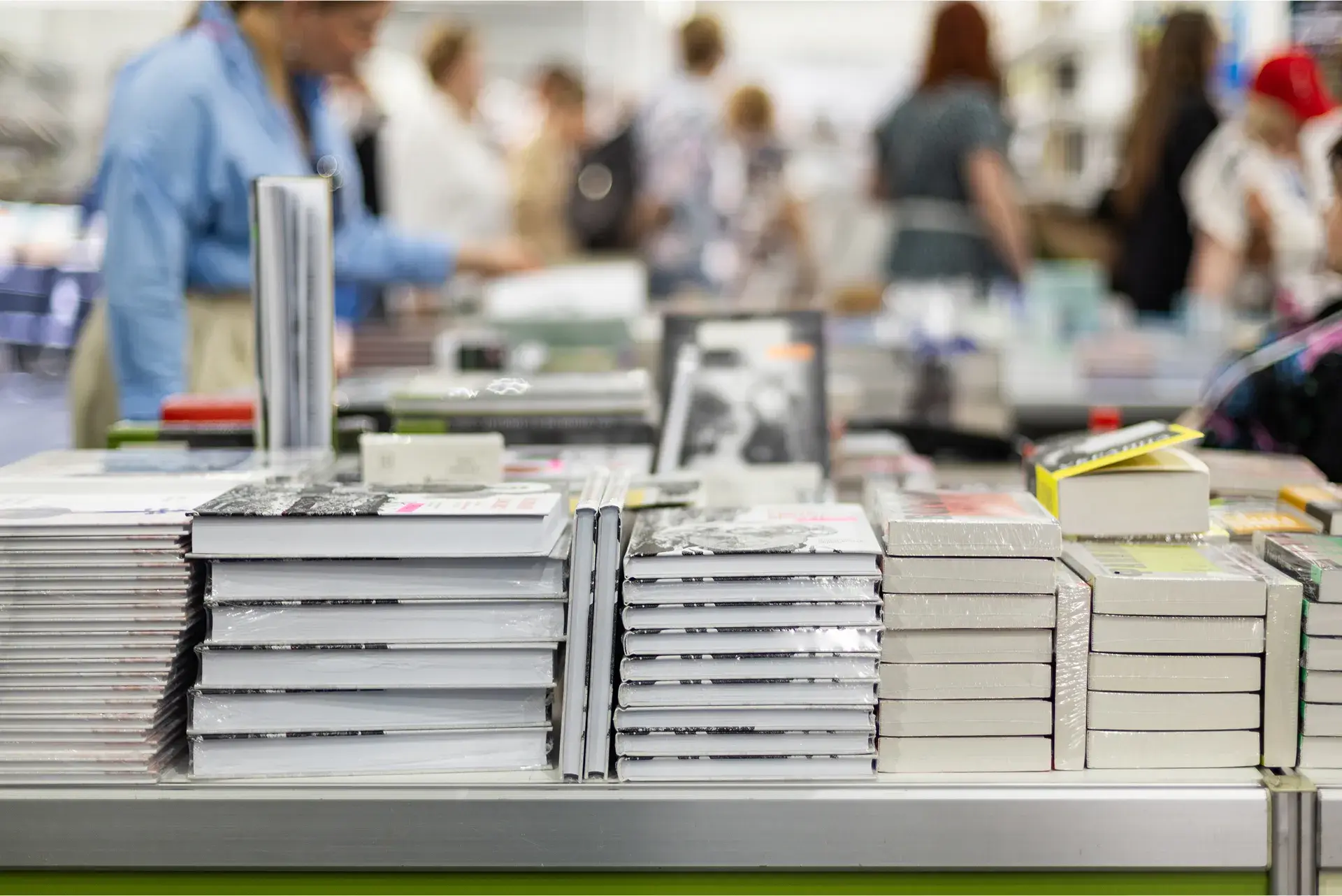 stacks of printed books on a table