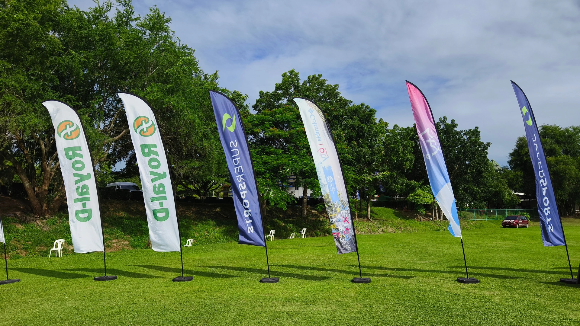 line of custom feather flags advertising Houston businesses